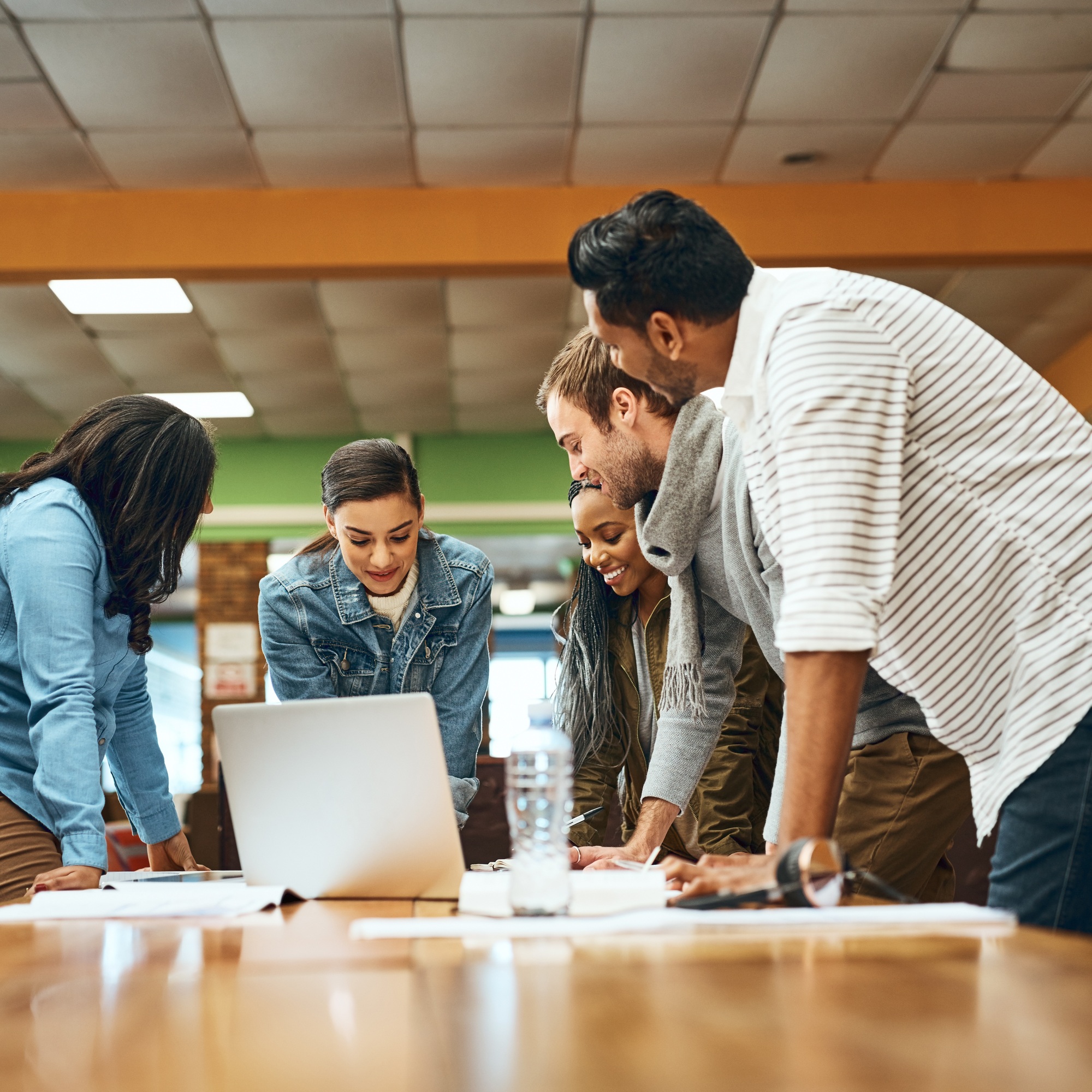 Cropped shot of a group of university students studying in the library